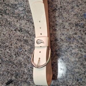 1980's White, 4in wide belt, 42 in. Long. I wore this in the 80's. Buckle is 3x3